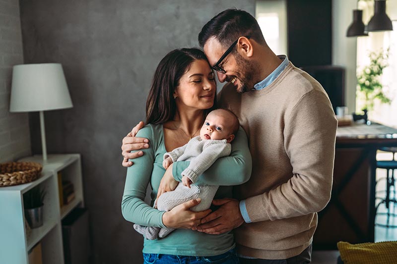 Family love parenthood baby concept. Parents spend happy moments with the newborn child